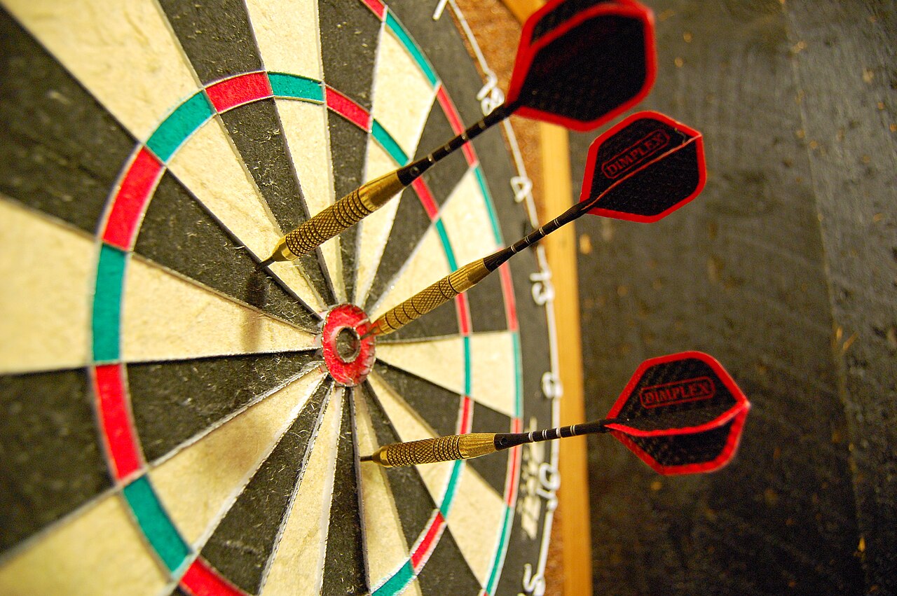 Real steel-tip dartboard with darts in the bullseye, from the original Space City Darts archive